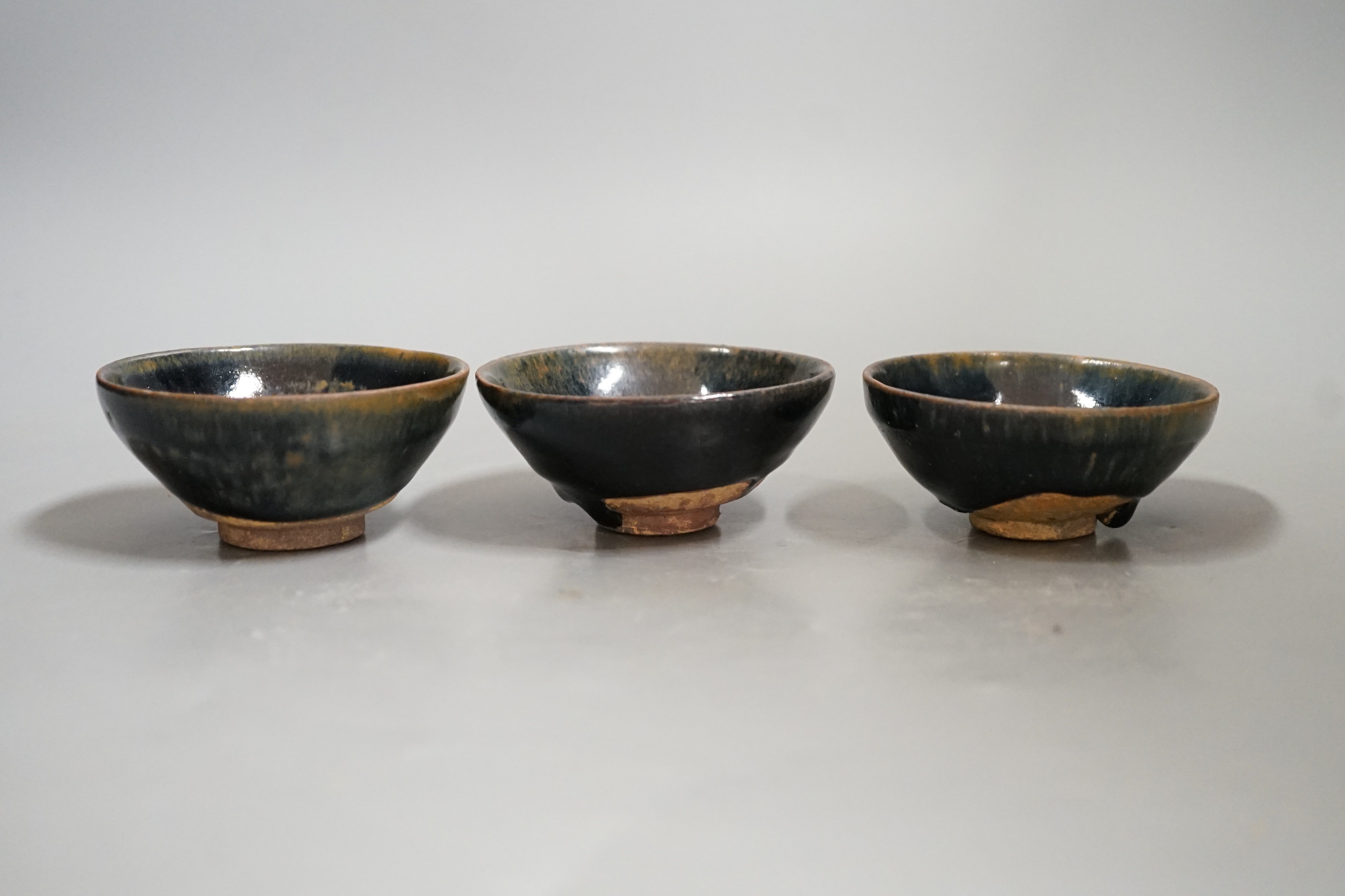 Three Chinese Jian type hare's fur bowls, 9cms diameter